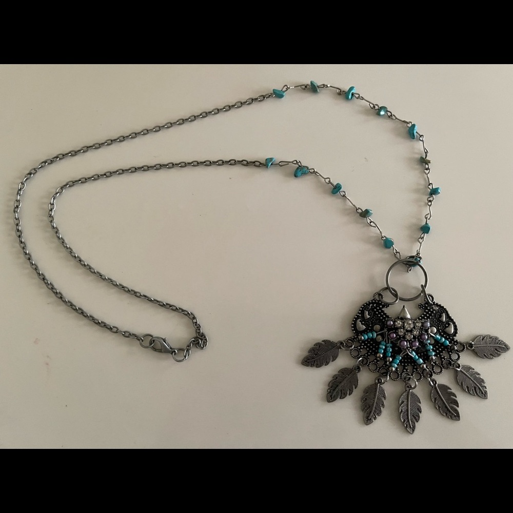 Necklace (intricate metal feathers, beads)